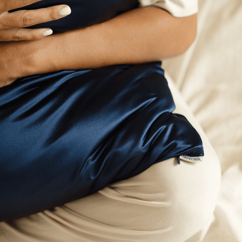 Navy blue silk pillowcase with a neutral colour scheme