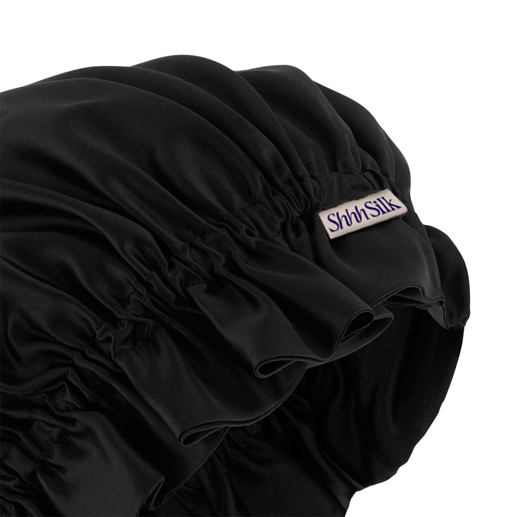 A black silk sleep bonnet