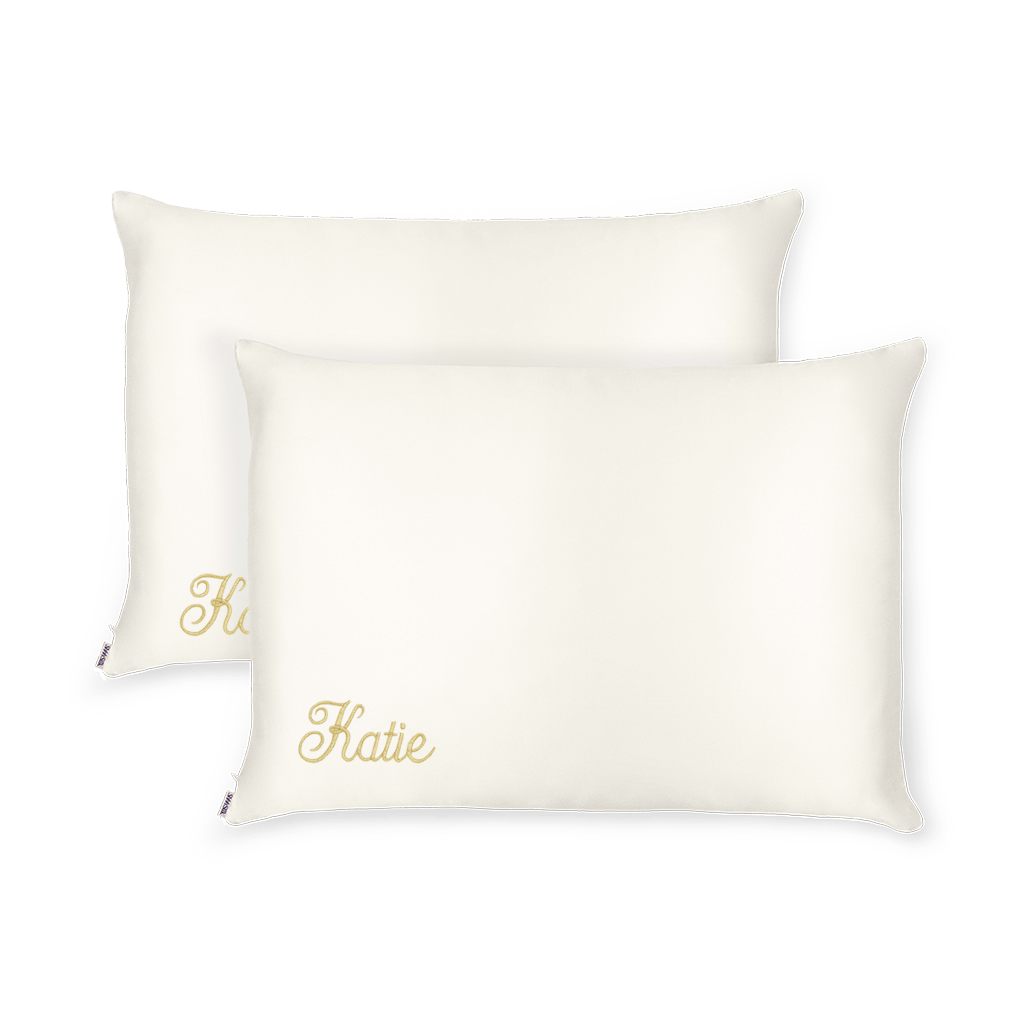 Two white pillowcases with the name 'Katie' printed on the bottom left.