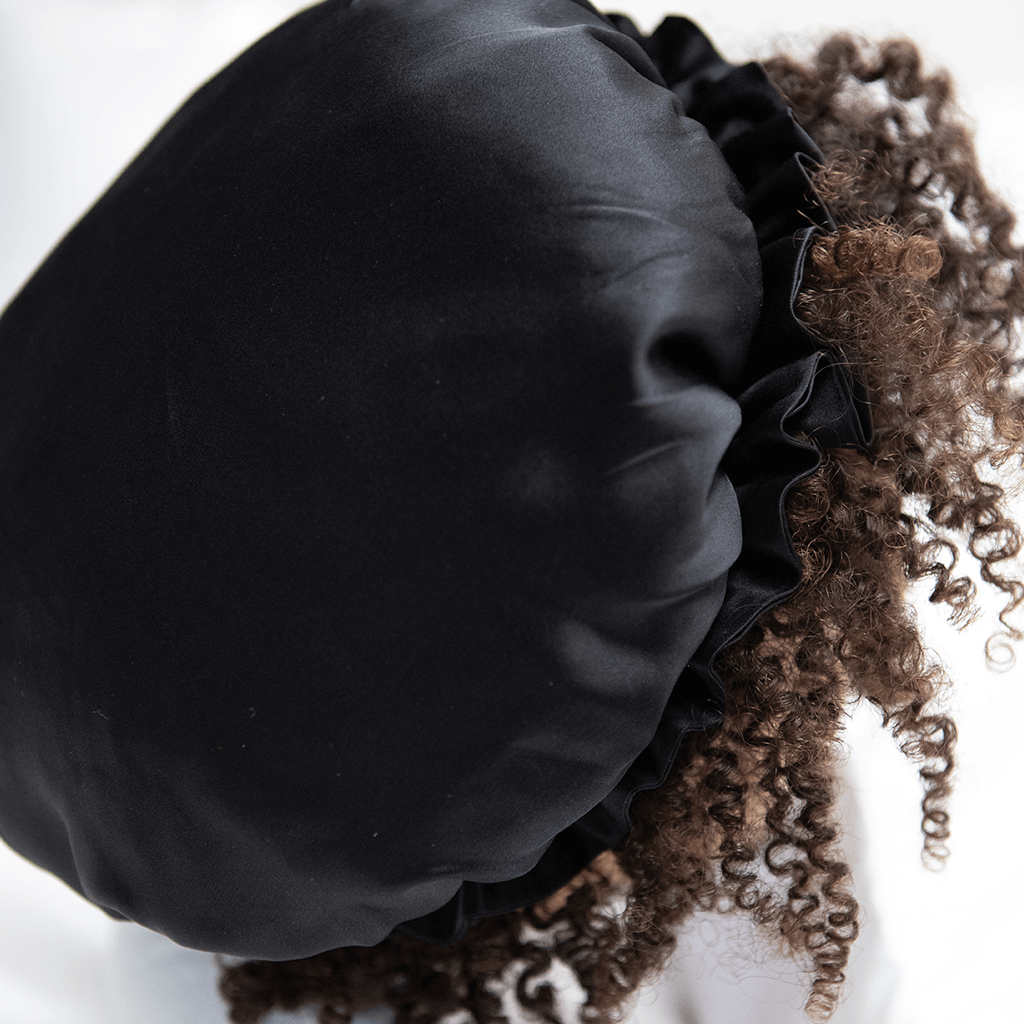 A black silk sleep bonnet